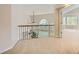 Upstairs loft featuring natural light, railing, doorway to adjacent bedroom and carpeted floor at 2215 Parkview Dr, Longmont, CO 80504
