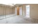 Spacious bedroom with neutral carpet and mirrored closet doors, providing a peaceful retreat at 710 Kittredge St, Aurora, CO 80011