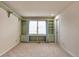 Bedroom with shelves beside a large bright window at 710 Kittredge St, Aurora, CO 80011