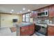 Functional kitchen layout with stainless steel appliances, lots of storage, and a breakfast nook at 710 Kittredge St, Aurora, CO 80011