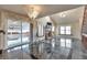 Bright living room with high ceilings, fireplace, and sliding glass doors to backyard at 710 Kittredge St, Aurora, CO 80011