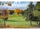 Autumn view of a golf course with mountain backdrop at 4922 Meade St, Denver, CO 80221