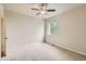 A light and airy bedroom includes neutral carpeting and a bright window at 853 Jenny Ln, Berthoud, CO 80513