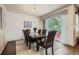 Elegant dining room with a large table, hardwood floors, and sliding glass doors at 853 Jenny Ln, Berthoud, CO 80513