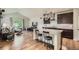 Modern kitchen featuring stainless steel appliances, granite countertops, and dark wood cabinets at 853 Jenny Ln, Berthoud, CO 80513