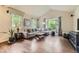 Bright living room with hardwood floors, vaulted ceilings, and large windows at 853 Jenny Ln, Berthoud, CO 80513