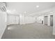 Spacious basement featuring neutral carpet, recessed lighting, and a convenient wet bar area at 5569 Willow Springs Dr, Morrison, CO 80465