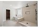 Bright bathroom featuring a freestanding tub, a frameless glass block window and a gorgeous shower with built-in bench at 5569 Willow Springs Dr, Morrison, CO 80465