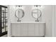 Elegant bathroom vanity with double sinks, modern lighting fixtures, and ample storage space at 5569 Willow Springs Dr, Morrison, CO 80465