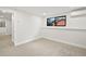 Bedroom with plush carpeting, natural light, and a mini-split air conditioner for comfort at 5569 Willow Springs Dr, Morrison, CO 80465