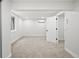 Comfortable bedroom featuring neutral carpet, a window and an open doorway at 5569 Willow Springs Dr, Morrison, CO 80465