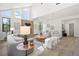 Bright, open living room featuring vaulted ceilings, a fireplace, and hardwood floors at 5569 Willow Springs Dr, Morrison, CO 80465