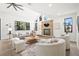 Spacious living room with fireplace, lots of natural light, and comfortable seating at 5569 Willow Springs Dr, Morrison, CO 80465