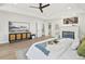 View of the main bedroom featuring a cozy fireplace, wood floors, and stylish accents at 5569 Willow Springs Dr, Morrison, CO 80465