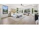 Spacious main bedroom with ample windows, ceiling fan, and sitting area at 5569 Willow Springs Dr, Morrison, CO 80465