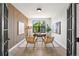 Bright office with a view of trees, wood feature wall, and French door access at 5569 Willow Springs Dr, Morrison, CO 80465