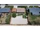 Aerial view of home with large yard and mature tree at 7961 Granada Rd, Denver, CO 80221