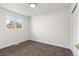 Bright bedroom offers soft carpeting and a window with a pleasant outdoor view at 7961 Granada Rd, Denver, CO 80221