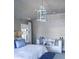 Comfortable bedroom featuring soft, neutral tones, a sitting area, and ample natural light at 2409 S Fillmore St, Denver, CO 80210