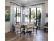 Dining room with floor to ceiling windows and modern lighting at 2409 S Fillmore St, Denver, CO 80210