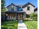 Charming two-story house with landscaped front yard and inviting entrance at 2409 S Fillmore St, Denver, CO 80210