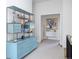 Hallway landing with a stylish blue shelving unit at 2409 S Fillmore St, Denver, CO 80210