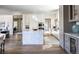 Bright, open kitchen with a large island, modern appliances, and hardwood floors at 2409 S Fillmore St, Denver, CO 80210