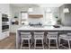 Well-appointed kitchen featuring a spacious island, modern appliances, and stylish finishes at 2409 S Fillmore St, Denver, CO 80210