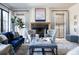 Comfortable living room with a fireplace, stylish seating arrangements, and elegant decor creating a cozy retreat at 2409 S Fillmore St, Denver, CO 80210