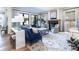 Elegant living room with a fireplace, plush seating, and bright natural light at 2409 S Fillmore St, Denver, CO 80210