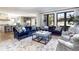 Spacious open-concept living room with elegant furnishings, flowing into a modern kitchen for seamless entertaining at 2409 S Fillmore St, Denver, CO 80210