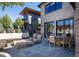 Stone patio with outdoor seating, a fire pit, and a view of the house at 2409 S Fillmore St, Denver, CO 80210