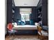 Charming reading nook with built-in shelving, window seat, and stylish decor at 2409 S Fillmore St, Denver, CO 80210