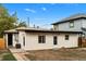 View of the back of the home with an access door and an external air conditioning unit at 3220 W 8Th Ave, Denver, CO 80204