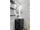 Modern bathroom featuring a vessel sink, contemporary fixtures, and sleek black accents at 3220 W 8Th Ave, Denver, CO 80204