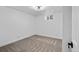 Bedroom with neutral carpet, white walls, trim and a modern ceiling light at 3220 W 8Th Ave, Denver, CO 80204