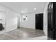 Spacious bedroom features modern flooring, large doors, natural light, and a connecting bathroom at 3220 W 8Th Ave, Denver, CO 80204