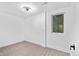 Bedroom with neutral carpet, white walls, trim and a modern ceiling light at 3220 W 8Th Ave, Denver, CO 80204