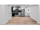Spacious kitchen area boasts stainless steel appliances and a modern design with sleek cabinetry and flooring at 3220 W 8Th Ave, Denver, CO 80204