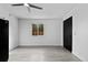 Bright living room features a ceiling fan and a window offering natural light at 3220 W 8Th Ave, Denver, CO 80204
