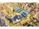 Aerial view of neighborhood amenities including tennis courts and a community pool at 3235 S Newland St, Denver, CO 80227