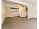 Spacious basement featuring light grey floors, a window, and white doors at 3235 S Newland St, Denver, CO 80227
