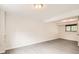 Basement featuring gray wood flooring, white walls, and a window with a view to the outside at 3235 S Newland St, Denver, CO 80227