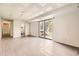 Basement with light grey floors featuring a walkout, a bathroom, and a white grid ceiling at 3235 S Newland St, Denver, CO 80227