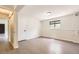 Bright basement featuring light grey floors and a window at 3235 S Newland St, Denver, CO 80227