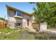 Charming two-story home with a landscaped yard and brick accents at 3235 S Newland St, Denver, CO 80227