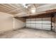 Spacious two car garage with ample space and a white sectional garage door at 3235 S Newland St, Denver, CO 80227