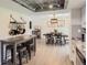 Bright dining and kitchen area with open concept design and modern lighting at 3235 S Newland St, Denver, CO 80227
