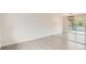 Bright and airy living room with modern flooring and sliding glass doors to the deck at 3235 S Newland St, Denver, CO 80227