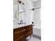 Chic bathroom with a sleek vanity, modern fixtures, and a stylish round mirror at 3346 W 30Th Ave, Denver, CO 80211